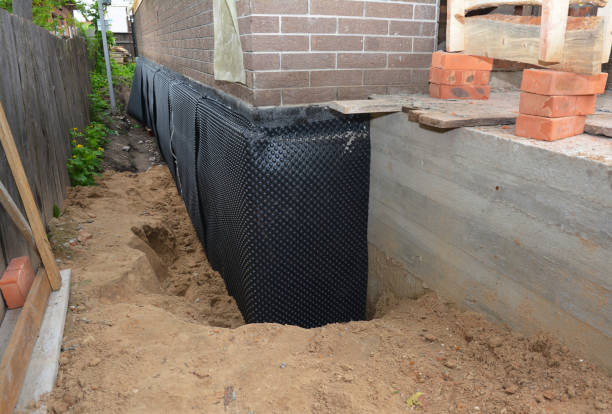 Happy homeowners after waterproofing job in Chapmansboro